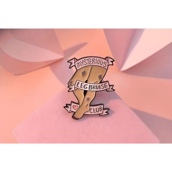MYSTERIOUS LEG BRUISE CLUB Enamel Lapel Backpack Pin NEW - Picture 2 of 3